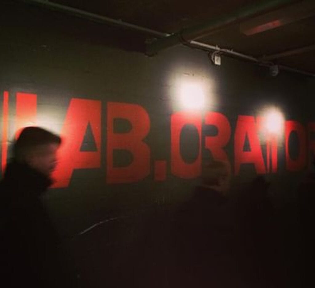Entrance to Lab.oratory, a key part of the Berlin gay nightlife experience, with an industrial and mysterious atmosphere.